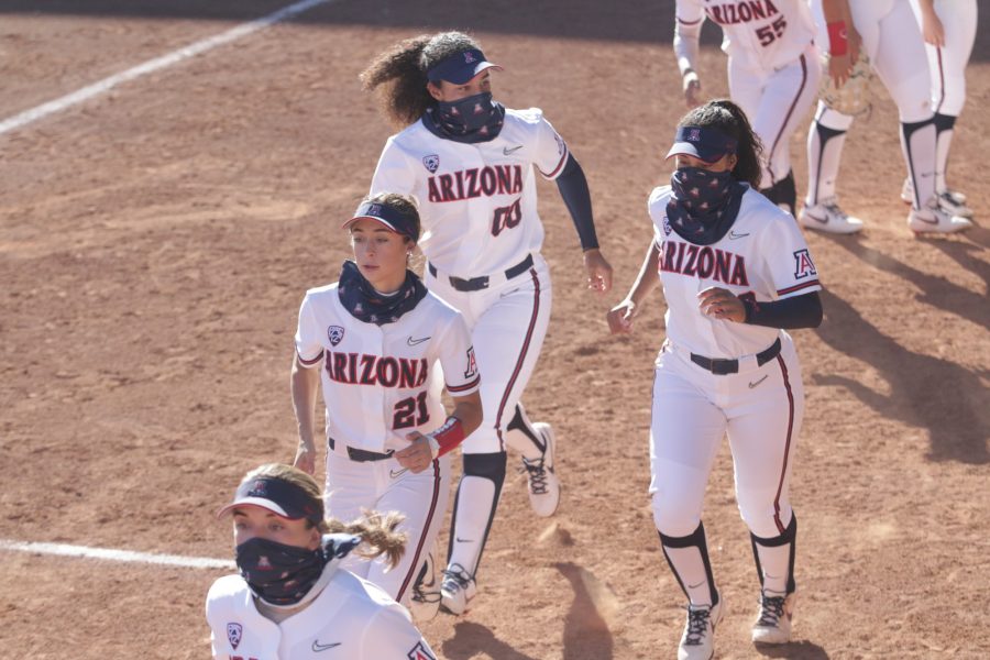 The Arizona softball team warms up during a game against Southern Utah on Sunday, Feb. 21, in Tucson, Ariz. The Wildcats won with an ending score of 10-1.