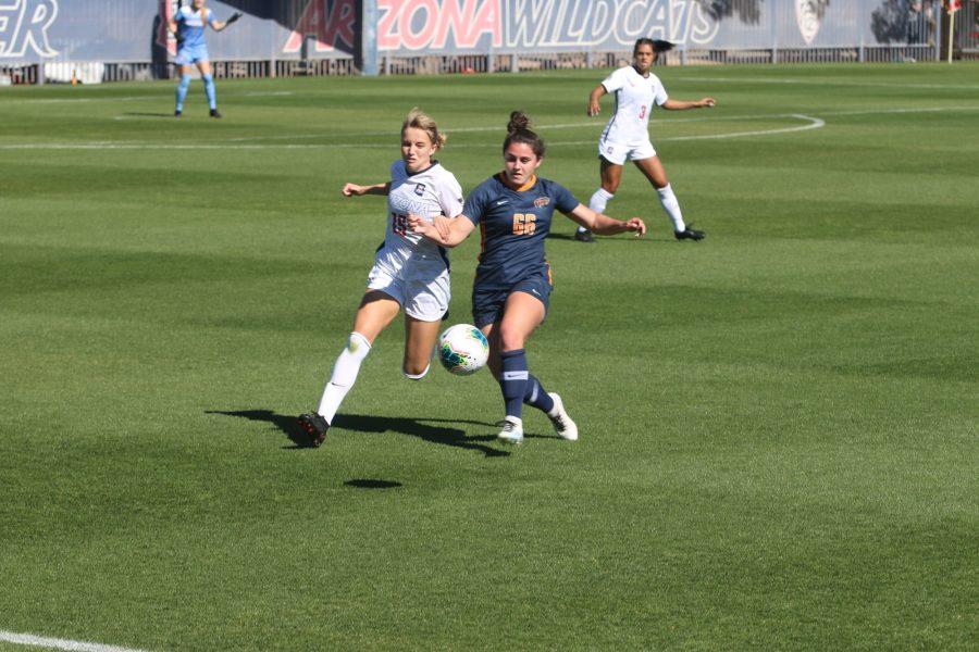 Ava Hetzel (15) fights for the ball during a match against UTEP on Sunday, Feb. 7 at Mulcahy Soccer Stadium. The Arizona Wildcats won against UTEP with a final score of 2-0.