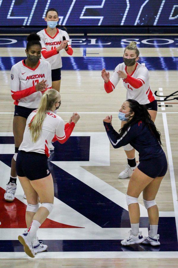 Women%26%238217%3Bs+volleyball+celebrates+scoring+on+Stanford+during+their+game+on+Sunday%2C+Feb.+7+at+McKale.+After+sweeping+the+cardinals+on+Friday%2C+the+cats+defeated+them+again%2C+winning+3+sets+to+1.