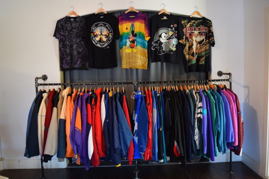 A colorful rack of vintage jackets and shirts for sale at Sids Vintage.They  sell hats, T-shirts and jackets.