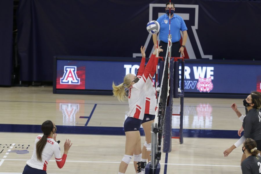 Merle Weidt (13) attempts to set the ball over the net during a game on Sunday, March 14, 2021. The Wildcats were victorious over the Colorado Buffalo by winning three out of four games.