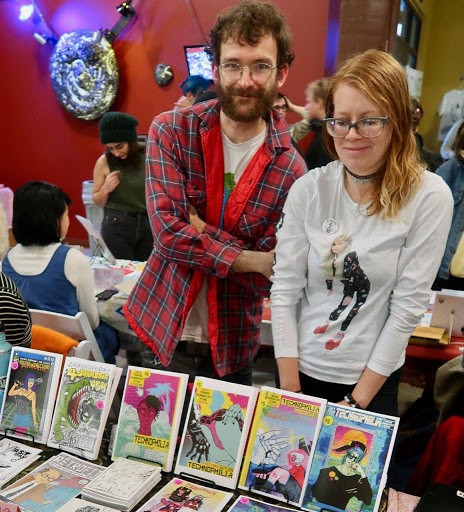 Tucson Zine Fest Co-Organizers Zac Finger (left) and Elisa Mask (right) at a 2017 Zine Fest in Eugene, Oregon, featuring their own artwork. Courtesy Elisa Mask 
