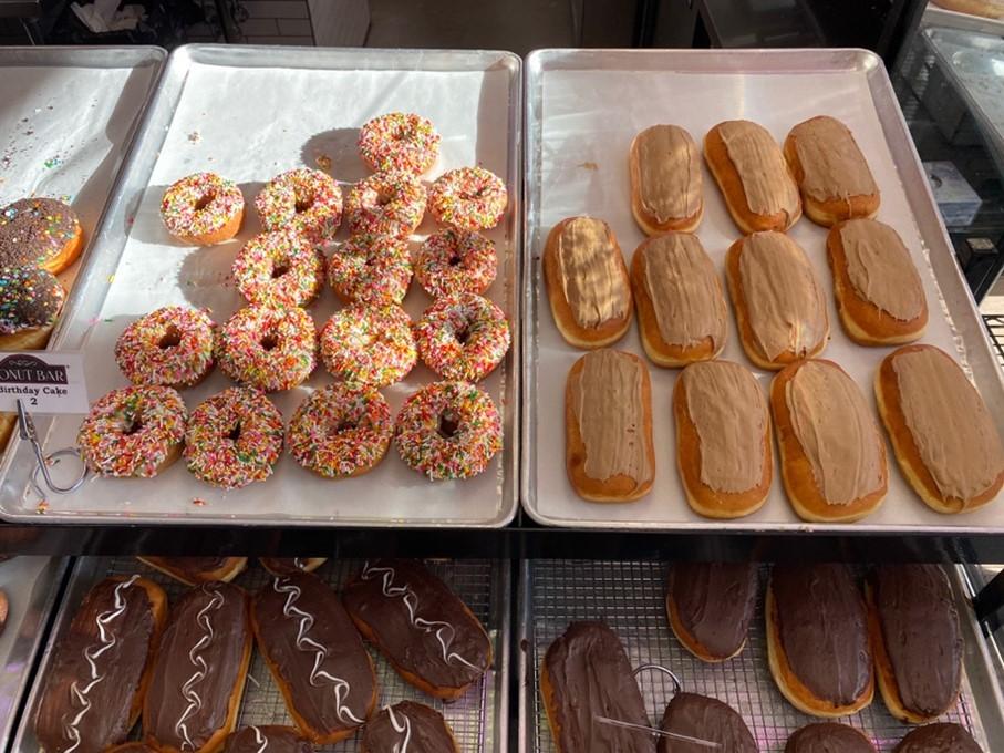   The Birthday Cake and Maple Bar donuts on display, waiting to be sold. Photographed by Jane Florance. 