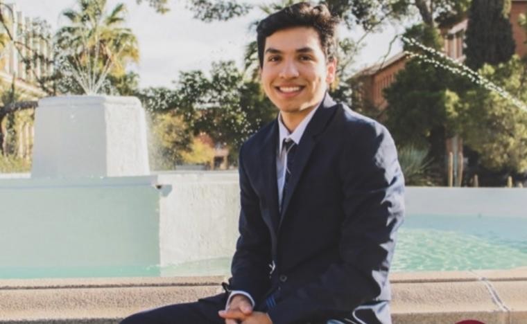 ASUA President Noah Vega poses in front of the fountain by Old Main.