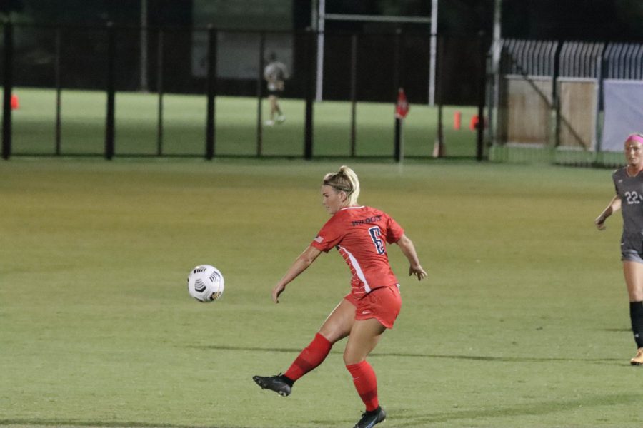 Number 6 Megan Chelf, a Sophomore on the University of Arizona Womens Soccer team, makes a pass to a teammate while a defender from Texas Tech follows at the Murphey Field at Mulcahy Soccer Stadium on Sept. 9. The Wildcats would go on to lose the game 1-2. 