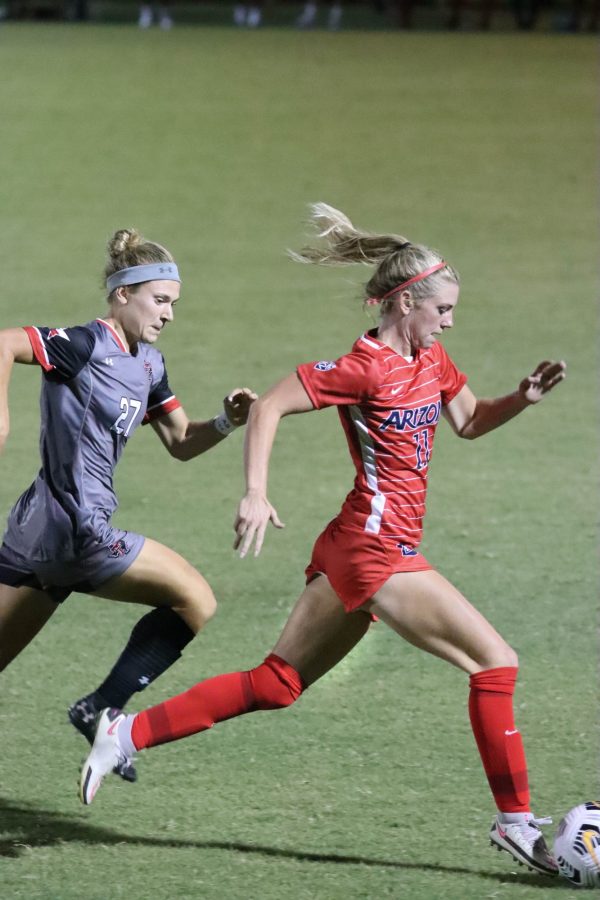 Number 11 Quincy Bonds, a Sophomore on the University of Arizona Womens Soccer team, receives a pass from a teammate and gets a breakaway run from the Texas Tech defenders at the Murphey Field at Mulcahy Soccer Stadium on Sept. 9. The Wildcats would go on to lose the game 1-2. 