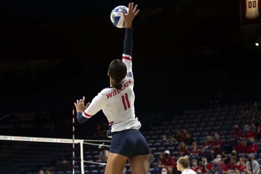 Jaelyn Hodge (11) spikes the ball towards Washington State at McKale Center on Oct. 10. The Wildcats went on to loose the game zero sets to three. 
