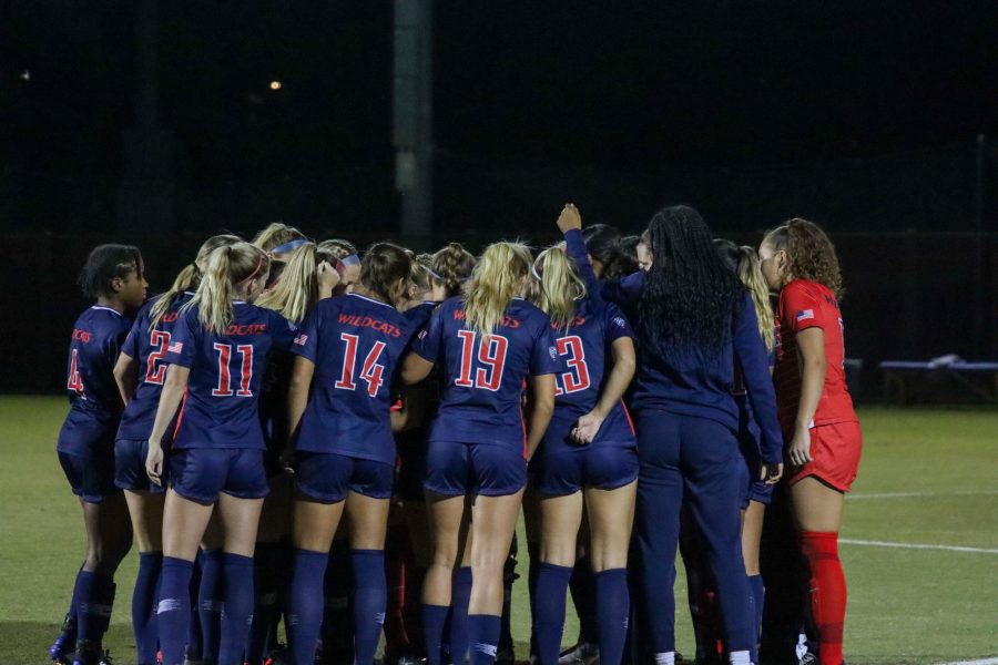 The University of Arizona womens soccer team has a pregame huddle before their game against the University of Washington at Mulcahy Soccer Stadium on Oct. 15. The Wildcats went on to lose the game 1-4.