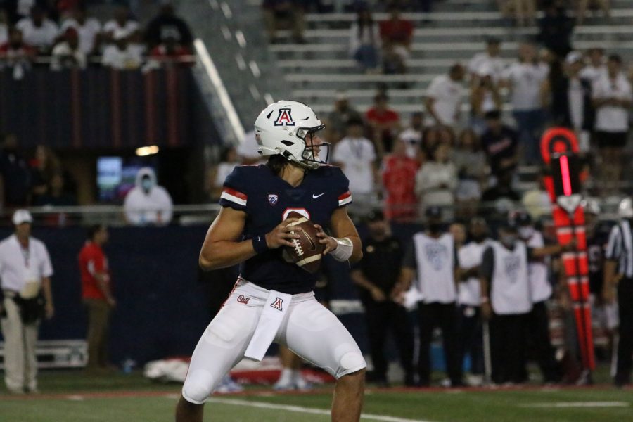Arizona quarterback, Gunner Cruz (9), reads the defense as he looks to pass the ball in the game against the University of California Los Angeles at Arizona Stadium on Oct. 9. Gunner took over for Jordan McCloud (4) after McCloud had to exit the game with an injury.