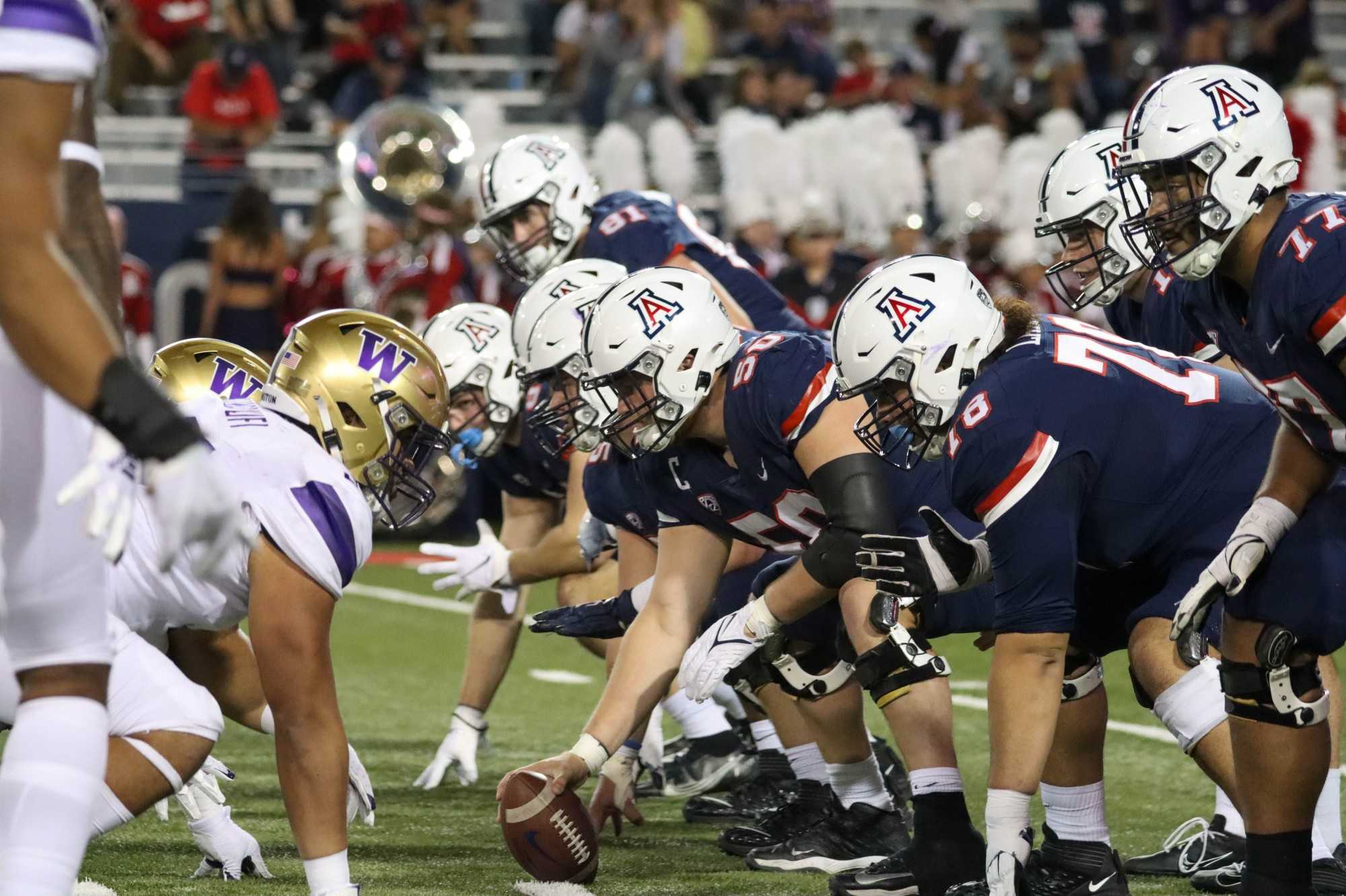 The University of Arizona Football team lines up on offense ready to start a drive against the University of Washington defense on Oct. 22 at Arizona Stadium. The Wildcats went into halftime up 13-0.
