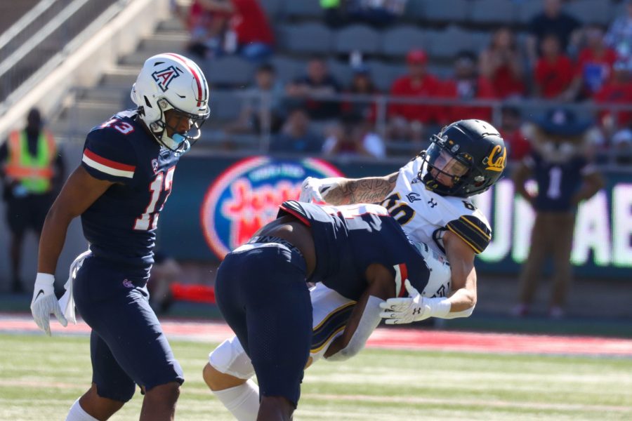 Christian Roland-Wallace, a sophomore on the Arizona football team, makes a  tackle, blocking a catch by a University of California, Berkeley receiver on Saturday, Nov. 6, at Arizona Stadium. At half time the score remains 0-0.