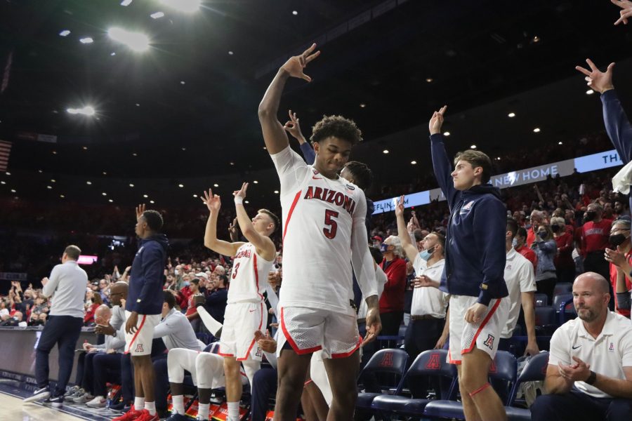 Justian+Kier%2C+a+guard+on+the+Arizona+mens+basketball+team%2C+celebrates+after+a+teammate+hits+a+three-point+shot+on+Saturday%2C+Nov.+27%2C+in+Mckale+Center.+The+Wildcats+went+on+to+win+the+game+105-60.