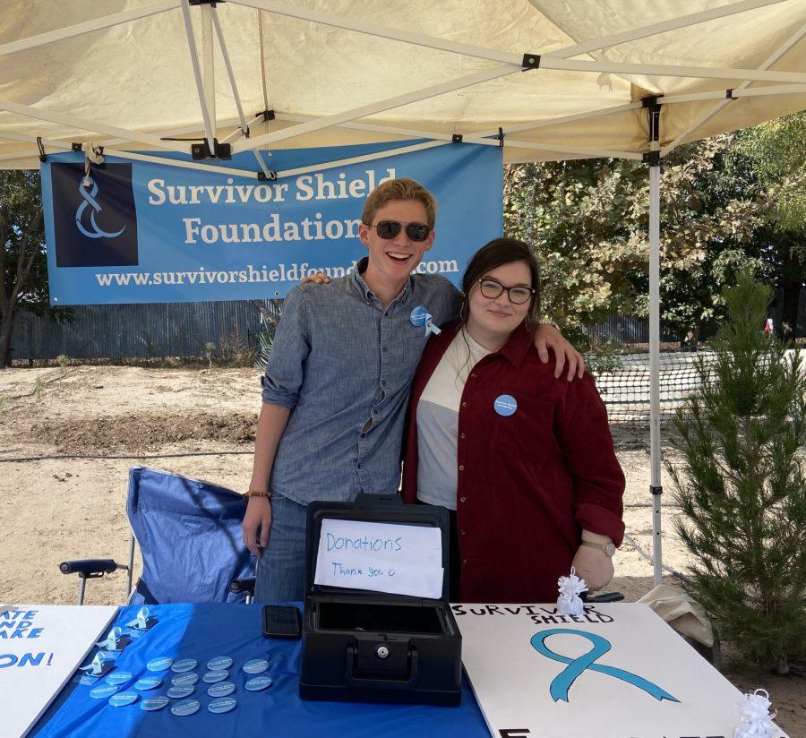 Jake Martin (left) poses for a photo with another individual under a Survivor Shield tent. Survivor Shield is an organization founded by Martin, which seeks to advocate on behalf of survivors of sexual assault. (Photo Courtesy of Jake Martin.)