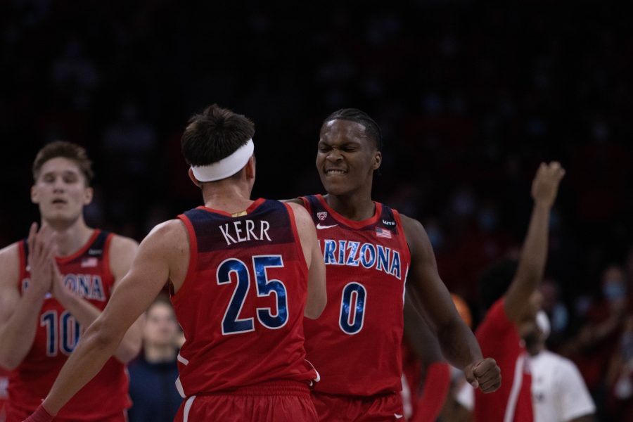 Kerr Kriisa (25) and Bennedict Mathurin (0) celebrate after a shot made by the Arizona mens basketball team in McKale Center on Jan. 29. The University of Arizona beat ASU 67-56.