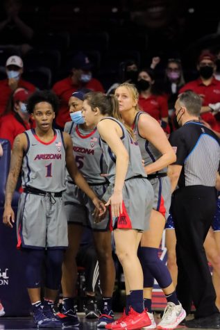 The Arizona woman's basketball team huddles after a foul on Sunday, Feb. 6 in McKale Center. The Wildcats would lead going into half 36-34.