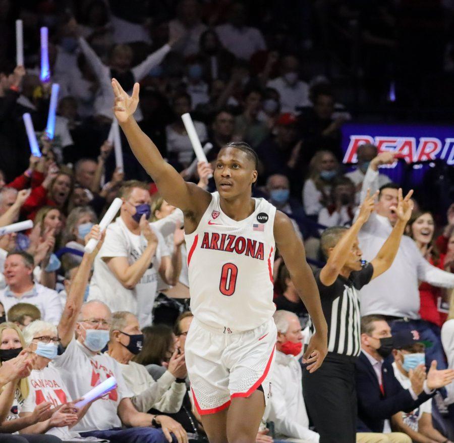Bennedict Mathurin, a guard on the Arizona mens basketball team, points to the sky after hitting a three-point shot on Saturday, Feb. 19 in McKale Center. The Wildcats would go on to win the final second of the game 84-81. 