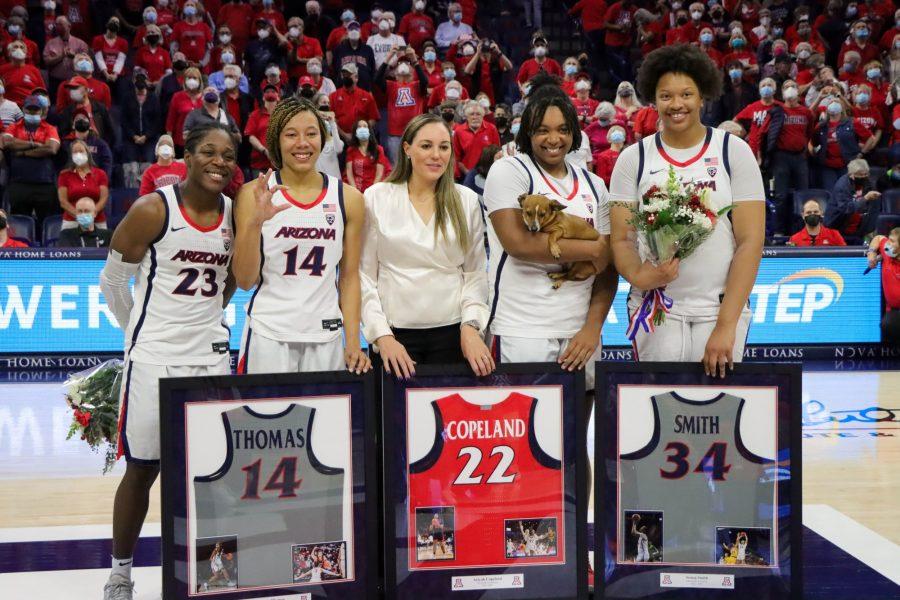 Senior teammates Bendu Yeaney, Sam Thomas, Ariyah Copeland and Semaj Smith of the Arizona womens basketball team stand with their coach Adia Barnes for senior pictures after beating the University of Southern California on Saturday, Feb. 26 in McKale Center. Yeaney has decided to do her graduate work at the UA and will be returning for next season.