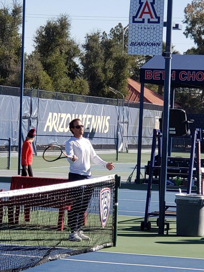 Arizona womens tennis coach Ryan Stotland shows his team how to do a drill in practice. 