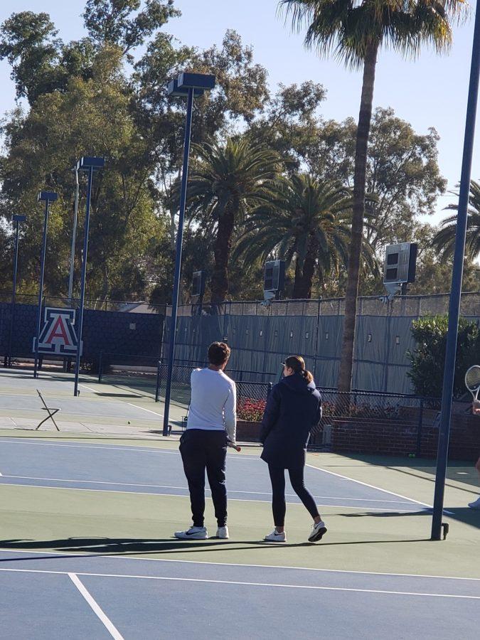 Arizona womens tennis team head coach Ryan Stotland and graduate student assistant coach Jelena Lukic talk during practice. 