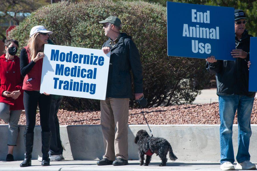 Protestors wave signs near the University of Arizona College of Medicine on Thursday, Feb. 24. Individuals were protesting against the use of live animals for medical studies at the UA.  