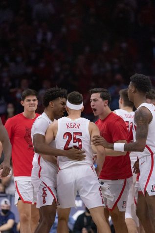 University of Arizona men's basketball team celebrate Kerr Kriisa's 3 point shot against University of Southern California on Saturday Feb. 5 at McKale Center. Kriisa scored 13 points for the wildcats helping them win the game 72-63.