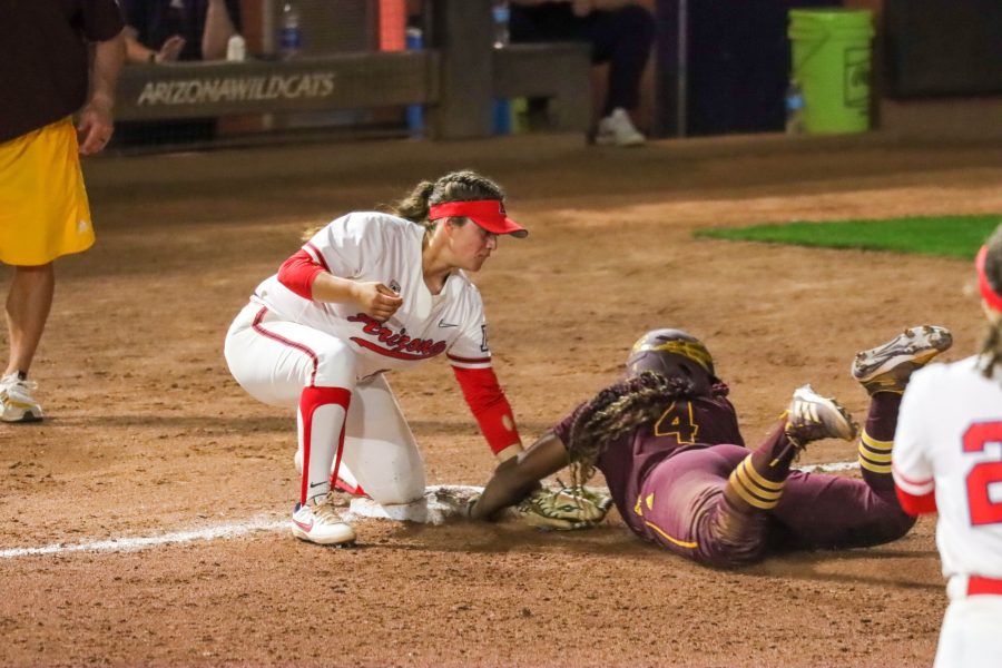 Izzy Pacho an infielder on the Arizona softball team tries to tag an Arizona state player out at third on Friday March 25 at Rita Hillenbrand Memorial Stadium. The Wildcats would loose 9-2.