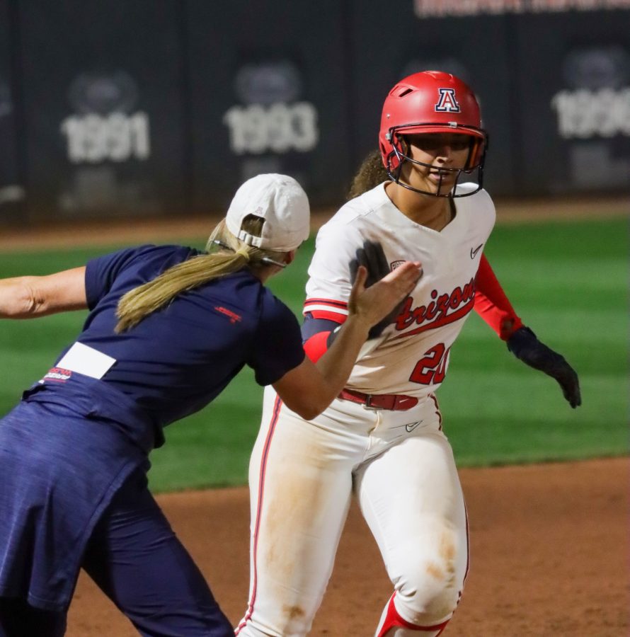 Carlie Scupin, an infielder on the Arizona softball team, hits a home run in the third inning scoring 2 runs on Friday, March 25 at Rita Hillenbrand Memorial Stadium. The Wildcats would lose 9-2.