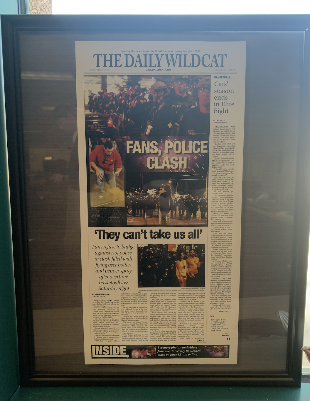 The front page of the Daily Wildcat on March 31, 2014 (volume 107, issue 122). The issue features coverage of the riots that occurred following the Arizona men's basketball team's loss in the Elite Eight to Wisconsin.