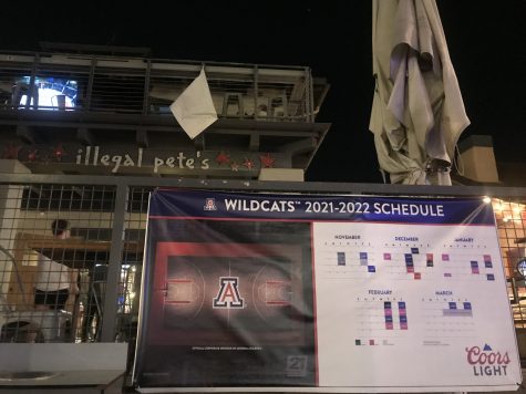 A 2022 March Madness sign outside of Illegal Pete's on University Boulevard. (Photograph by Diana Ramos)