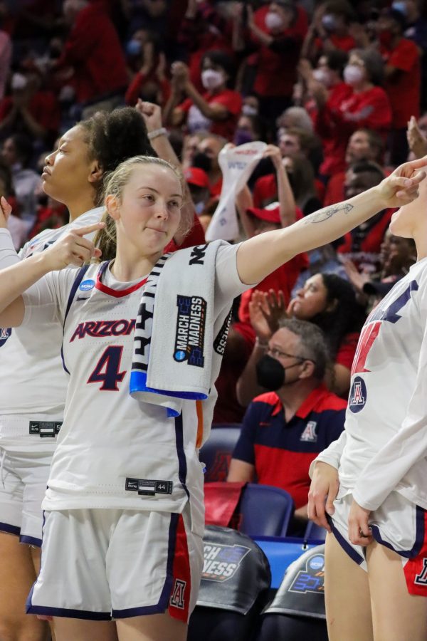 Maddison Conner a guard on the Arizona womens basketball team points in the direction of the Wildcat basket after a teammate steal on March 19 in McKale Center. The Wildcats would win 72-67.