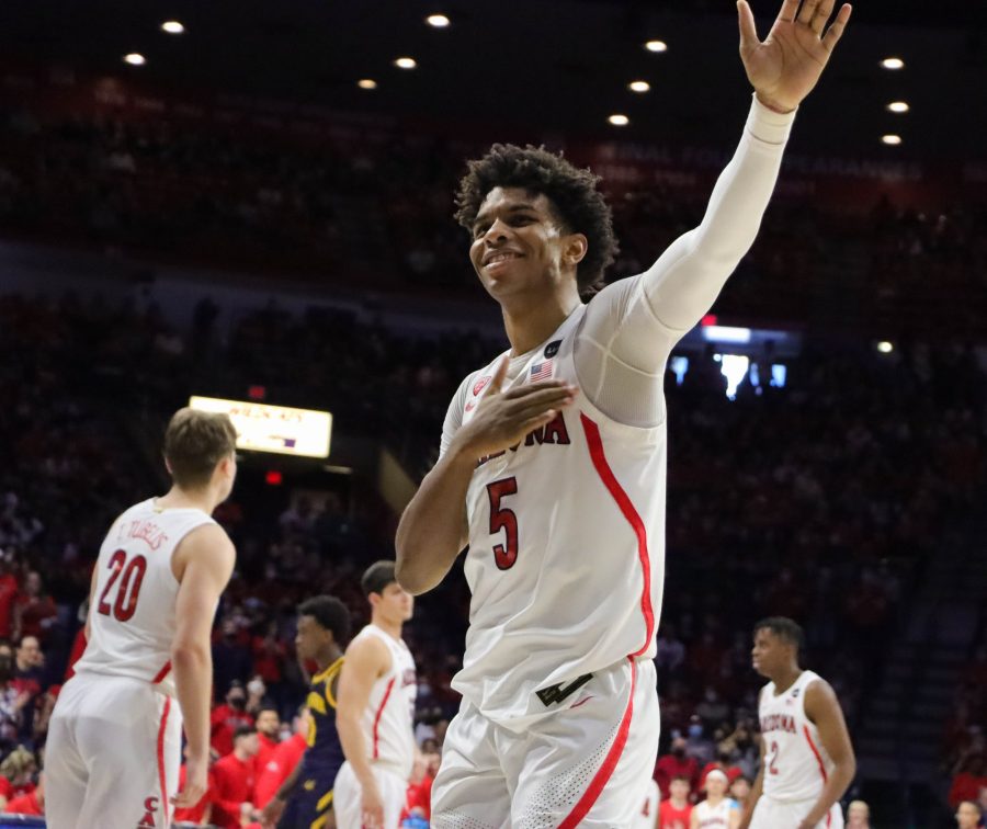 Justin Kier, a guard on the Arizona mens basketball team, waves to fans as his last regular-season game ends on Saturday, March 5 in McKale Center. Kier would help the Wildcats win the game 89-61.