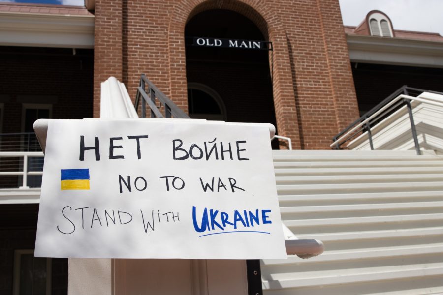 A sign in Russian and English advocating for Ukrainian support hangs outside of Old Main on March 29. A peace rally to end the conflict in Ukraine was held in Old Main on Tuesday.