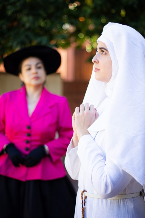 Suor Angelica (played by cast member Clarissa Smith), right, prays after her aunt (played by cast member Diana Peralta) tells her that her illegitimate son has died. (Courtesy of Mindi Acosta, University of Arizona Fred Fox School of Music)