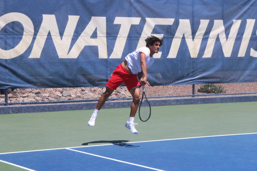 Arizonas Carlos Hassey makes a swing during a match against the University of California, Berkeley on April 3 at the Robson Tennis Center. The day ended with Arizona beating Cal for the first time in 13 years.