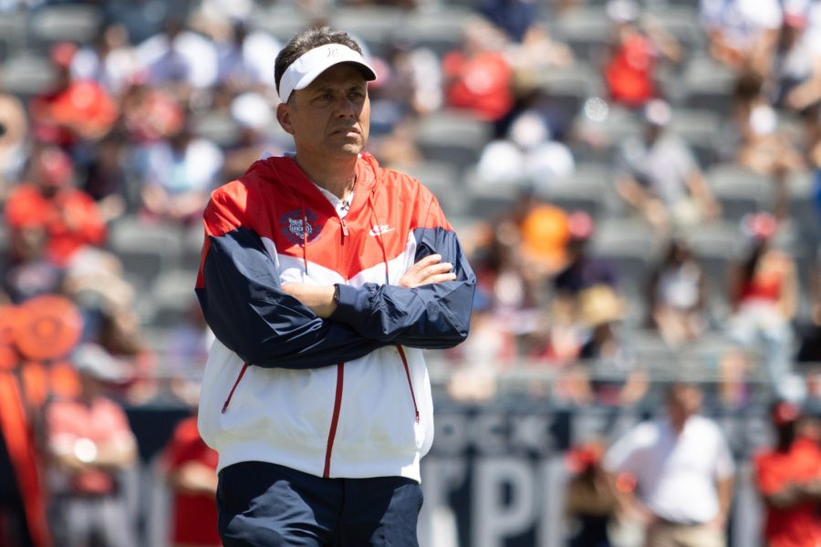 University of Arizona head coach, Jedd Fisch, watches his players as they run a play at Arizona Stadium on April 9. Fisch is entering his second year as head coach of the Wildcats.