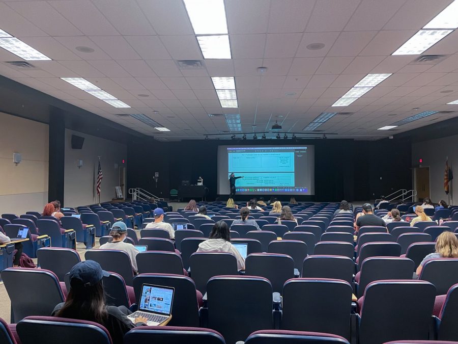 University of Arizona students wait for their psychology class to start in a lecture hall on Thursday, March 31.