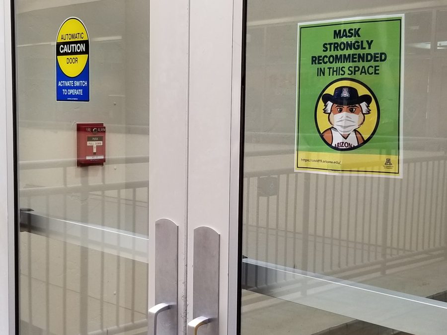 A sign outside of the University of Arizonas Student Union Memorial Center food court says masks are strongly recommended inside the building. An illustration of Wilbur the Wildcat wearing a mask is featured under the text. After UA President Dr. Robert C. Robbins lifted the schools mask mandate during the spring 2022 semester, these recommendation signs were placed all around campus.