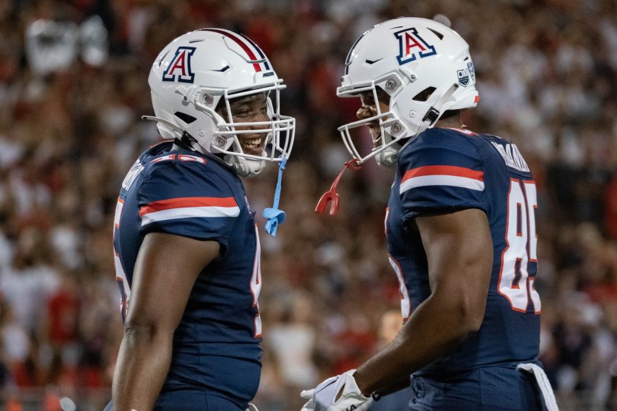 Wildcats Issaiah Johnson (left) and Roberto Miranda (right) have smiles on their faces before a game against Mississippi State University on Sept. 10, 2022 at Arizona Stadium. The Wildcats would lose 39-17. 