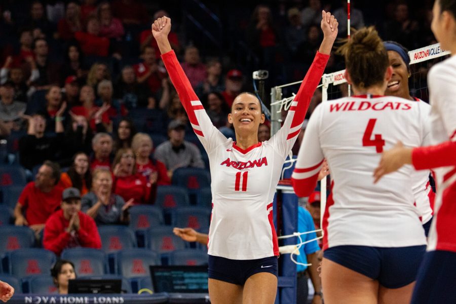 Jaelyn Hodge (11) celebrates scoring a point in a game against the University of Oregon on Oct. 28 in McKale Center. The Wildcats would go on to lose the game 1-3.