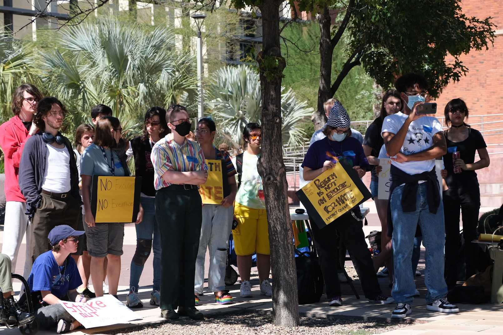 Protesters gather outside the Administration building on the University of Arizona campus on Tuesday Oct. 11. The protest was a nation wide walk out for the enforcement of tittle nine at religious schools. 