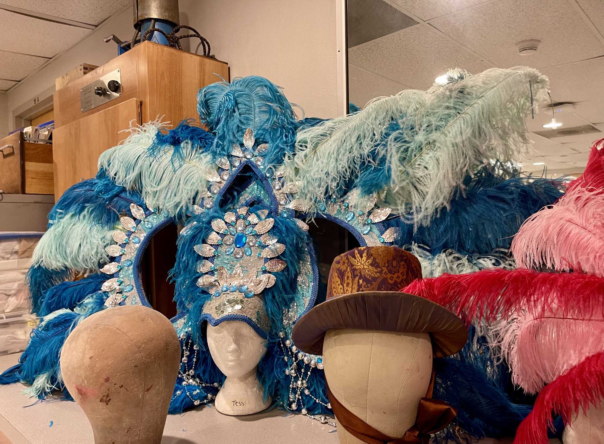 Elaborate headdresses for "Vaud" rest on a table in the University of Arizona’s costume department on Monday, Nov. 21. (Photo by Hannah Cree)