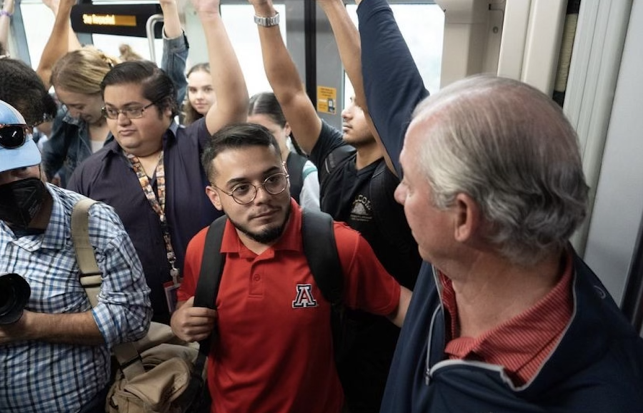ASUA Student Body President Patrick Robles rides the SunLink with University of Arizona President Dr. Robert C. Robbins for the #WhyIRide campaign. (Photo by Alex Ray Sanchez)