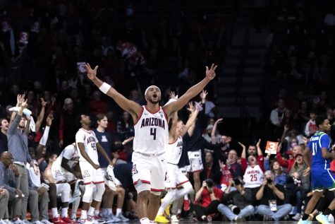 Arizona men’s basketball player Kylan Boswell celebrates his teammates 3-point score on Dec. 13, 2022 in McKale Center. The Wildcats won the game against Texas A&M University-Corpus Christi with a score of 61-99.