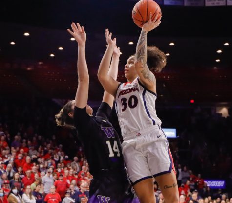 Jade Loville (30) a gaurd on the Arizona women's basketball team takes a shot in a game against University of Washington on Jan. 27, in McKale Center. The Wildcats won the game 61-54.