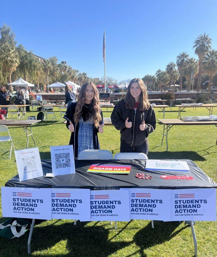 Ryan Hicks (left) and Maddie Mortenson (right) set up a table on the University of Arizona Mall for Students Demand Action, a new organization on campus. Their group is dedicated to ending gun violence and providing a safe space for survivors and all those who care about the issue. (Courtesy Ryan Hicks)
