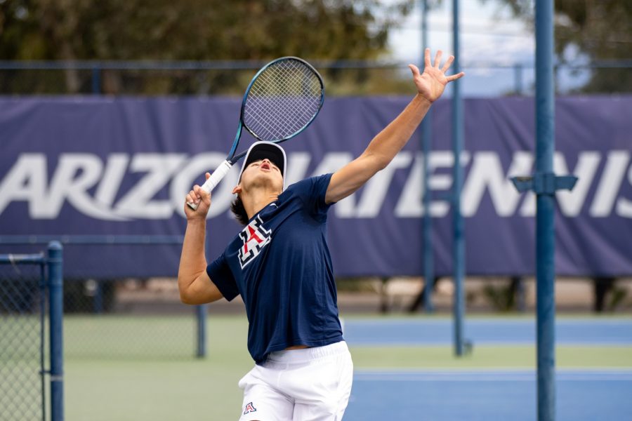 Eric Padgham serves the ball in a doubles match at a game against Pepperdine University on Feb. 3 at the LaNelle Robson Tennis Center. The Wildcats went on to win the match 6-1. 