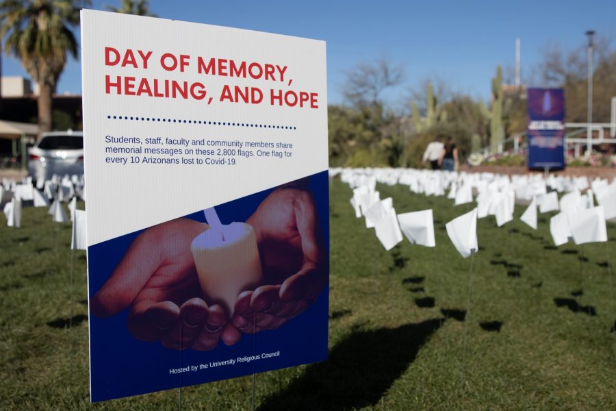 The+University+Religious+Council+hosted+a+day+of+memory%2C+healing+and+hope+to+memorialize+the+lives+of+Arizonans+lost+to+COVID-19+on+March+23%2C+2022%2C+on+the+University+of+Arizona+Mall+in+Tucson%2C+Ariz.+There+were+2%2C800+flags+placed+on+the+lawn%2C+some+with+handwritten+messages%2C+with+each+flag+representing+10+Arizonan+lives+lost+to+the+virus.+