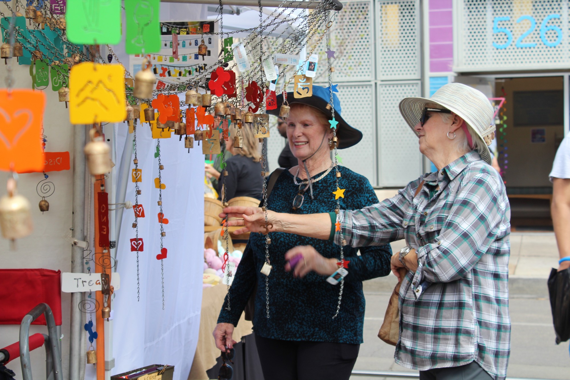 Two women stop and look at windchimes at the Fourth Avenue Spring Street Fair on March 24. The street fair ran for three days straight, closing off Fourth Avenue to all but pedestrians. 