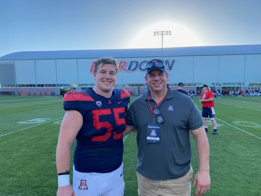 Arizona+football+offensive+lineman+JT+Hand+%28left%29+poses+with+his+father+and+Arizona+football+alumn+Bryan+Hand+%28right%29+during+a+spring+practice.+%28Courtesy+of+JT+Hand%29.