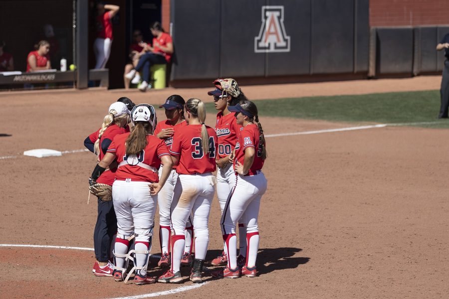 The Arizona softball team huddles up during the game against UCLA on April 15 in Hillenbrand Stadium. The Wildcats went on to lose the game 8-4.